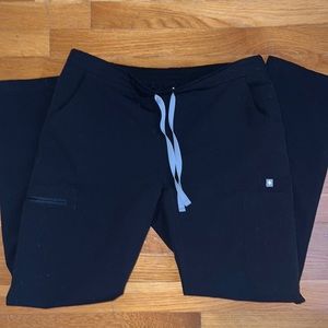 Black FIGS scrub pants.